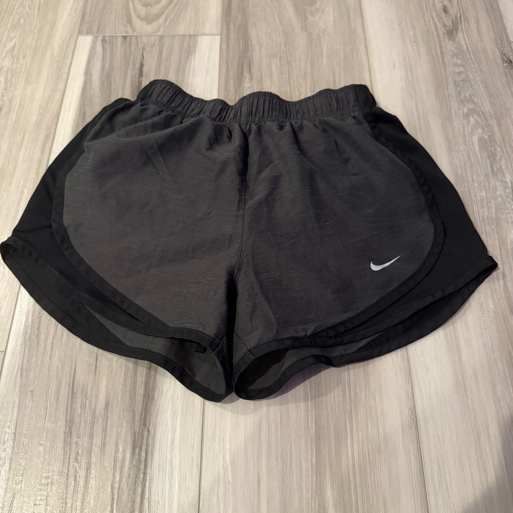Nike Black Athletic Shorts with Curved Hem and Dri-FIT Fabric